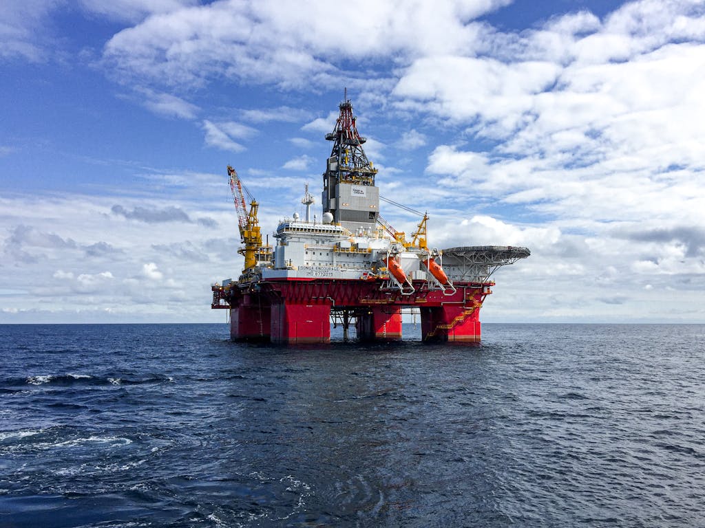 Majestic offshore oil platform under a bright sky in the North Sea, showcasing Norway's energy infrastructure.